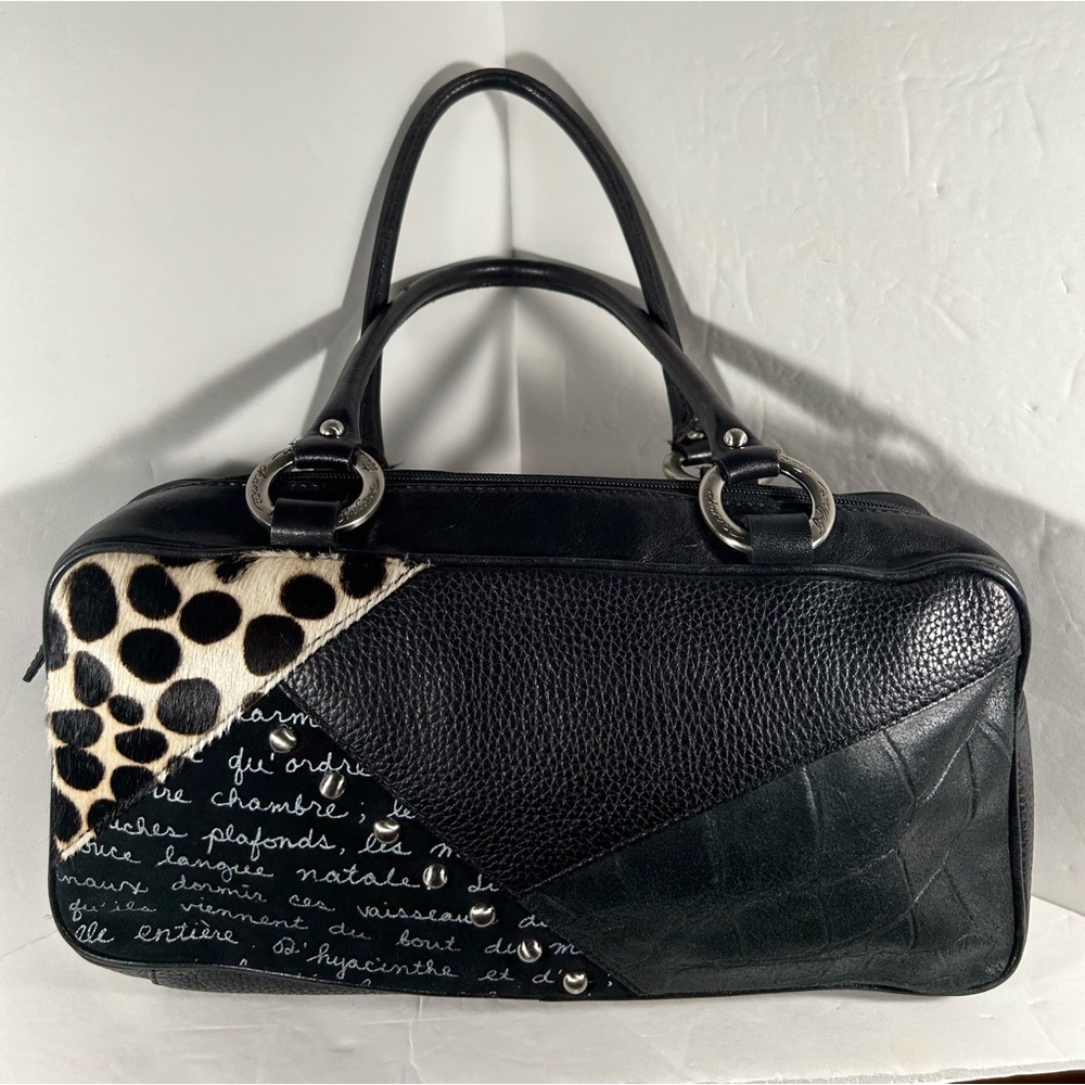 Woman’s leather purse with prints.